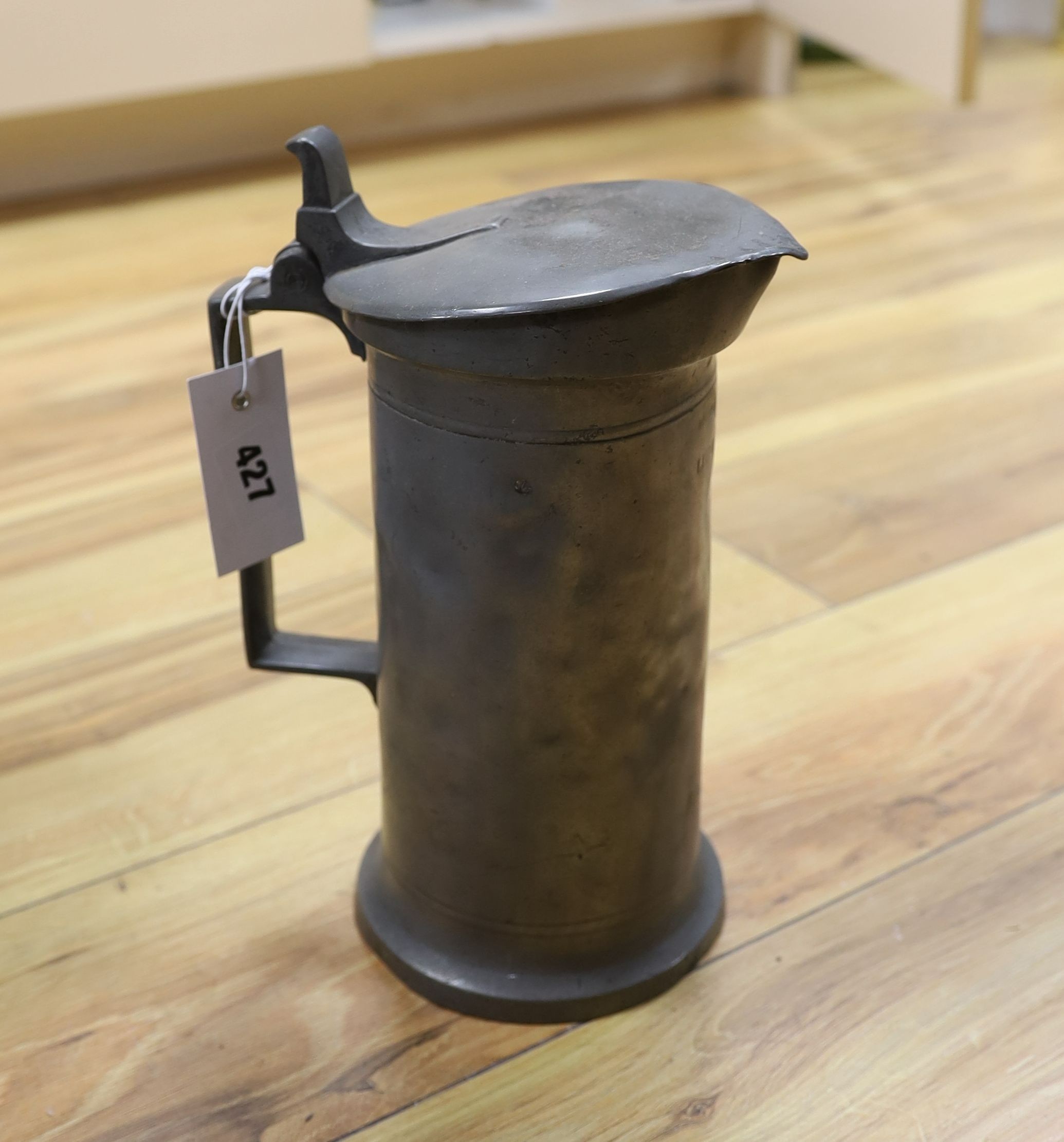 A selection of pewter measures together with an inkstand and miniature wicker furniture (1 box)